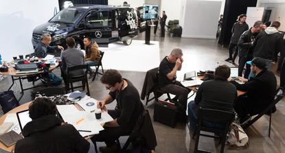 Teams working on hacking the inside of the Vito van