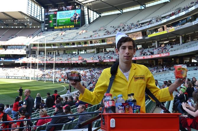 One of the pie boys offering free pies to Melbourne Cricket Ground patrons during the iBeacon trial. Photo credit: Melbourne Cricket Club.